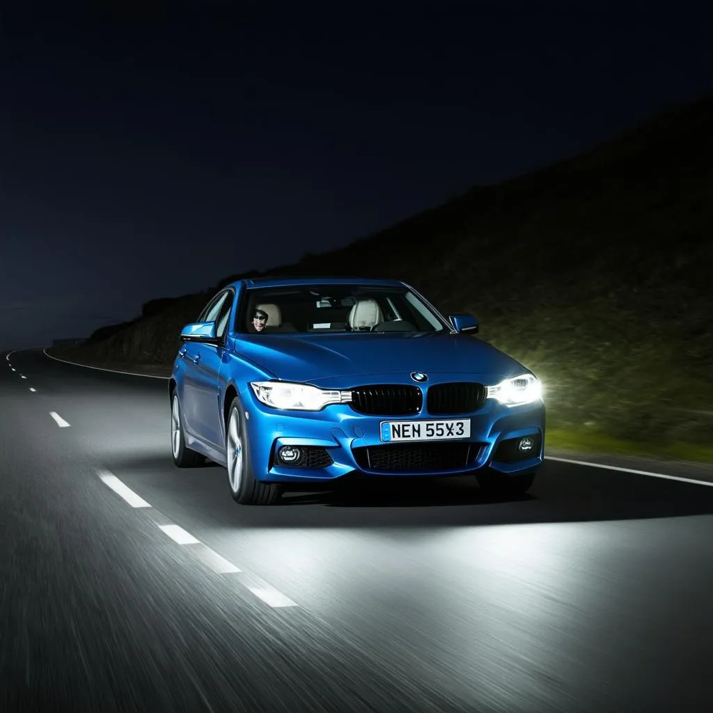 BMW F30 with xenon headlights on a night road