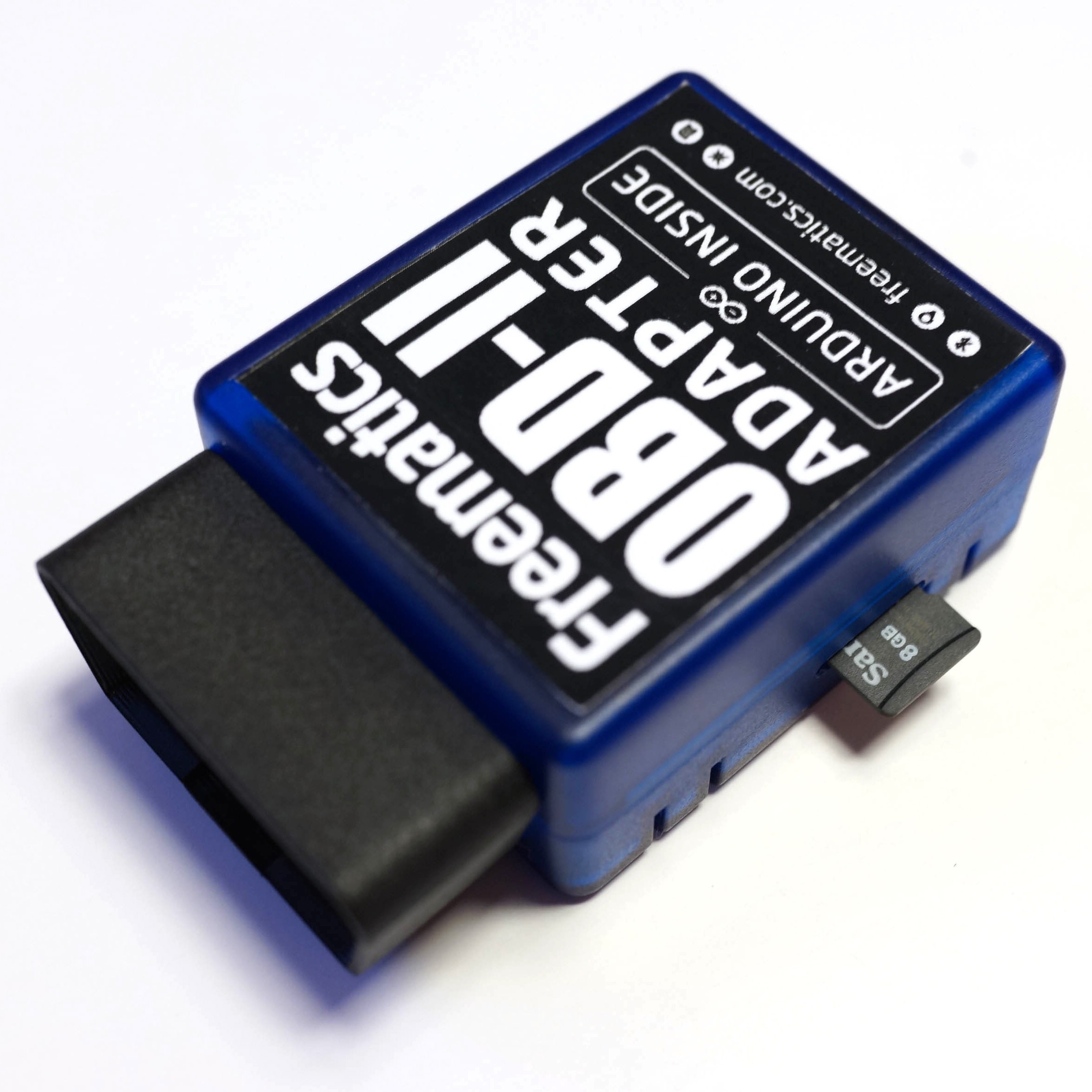 The Freematics OBD-II Data Logger plugged into a car's OBD-II port.