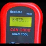 alt text: A person using the Autel MaxiScan MS300 to diagnose a car problem.