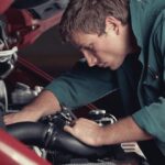 Mechanic working on a car engine