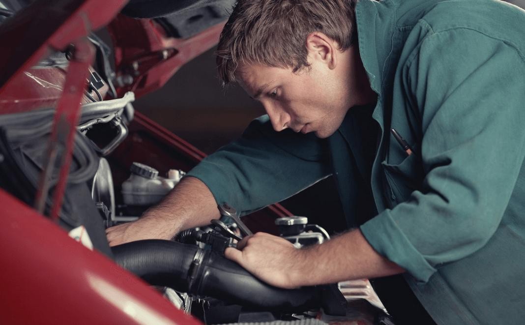 Mechanic working on a car engine